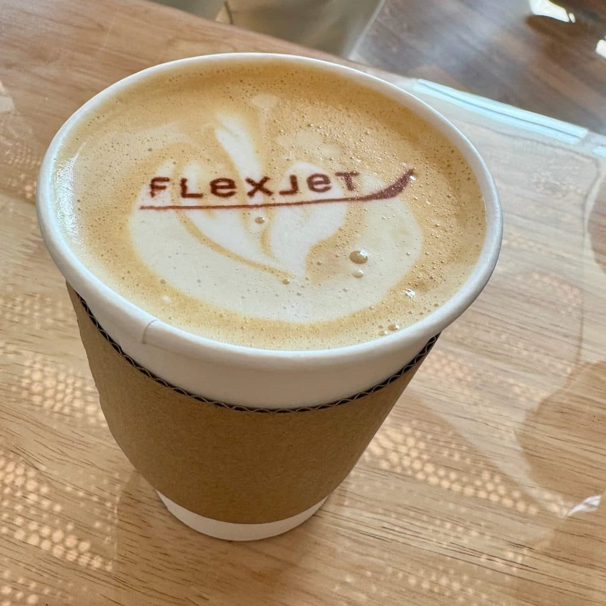Hot latte with a client logo printed in the foam at a Cleveland corporate event