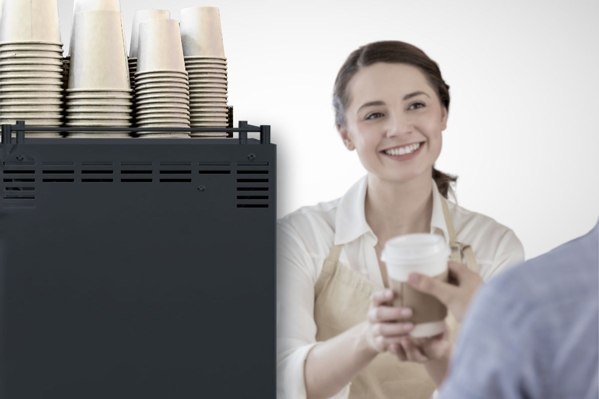 Barista handing a finished drink to a guest