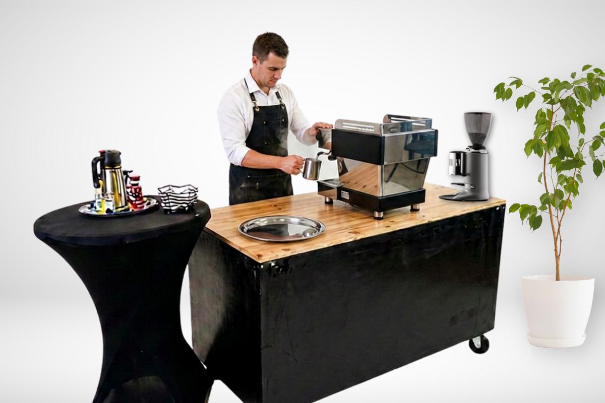 Cleveland Espresso barista steaming milk at the coffee cart