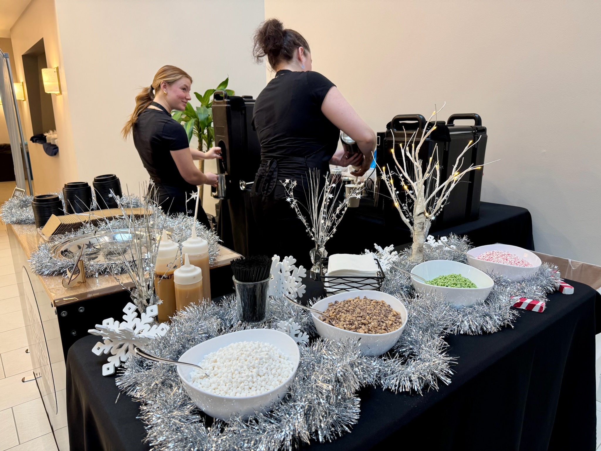 Cleveland Espresso baristas serving guests at a coffee bar catering event