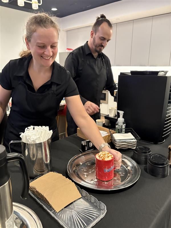 Mobile coffee cart barista crafting espresso drinks